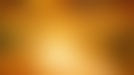 A warm gradient of amber and gold hues with a soft luminous glow in the center. Clear details and...の写真素材