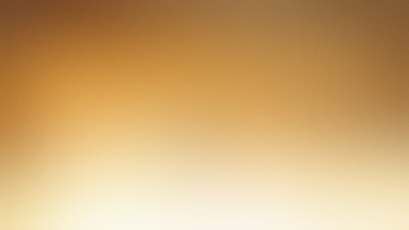 A warm gradient transitioning from golden amber to soft white with a gentle blur. Clear details a...の写真素材