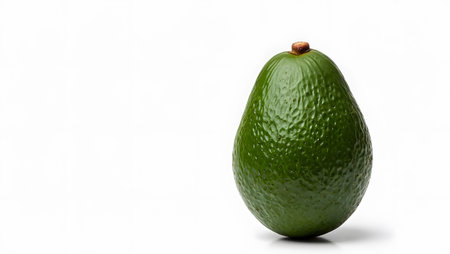 Stock showing green avocado fruit with textured skin isolatedの写真素材