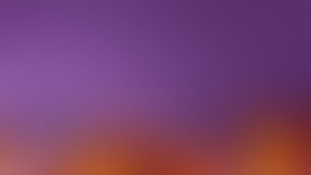 A smooth gradient transitions from soft purple to warm orange with a subtle textured effect.の写真素材