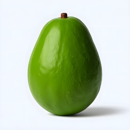 A smooth, bright green avocado with a small brown stem isolated on white. Clear details and vibra...