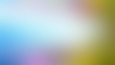 A soft gradient blends blue, pink, and yellow-green tones with a subtle textured effect.の写真素材