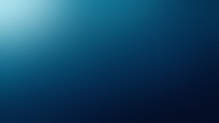 A dark blue gradient with a subtle texture and a soft light effect on the left. Clear details and...の写真素材