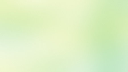 A pale green and yellow soft gradient background with a subtle texture. Clear details and vibrant...の写真素材