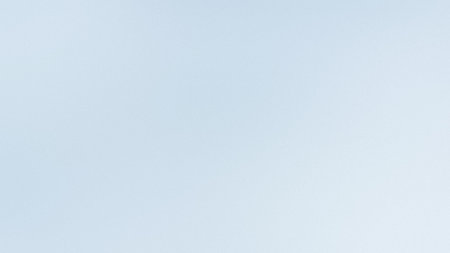 A very pale blue and white subtle gradient background with a soft, diffused feel. Clear details a...の写真素材