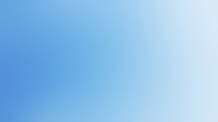 A smooth gradient background transitioning from soft blue to white with a subtle texture.の写真素材