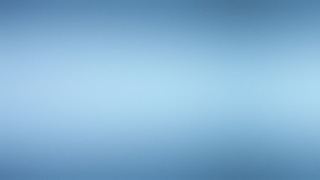 A soft blue blurred gradient background with a subtle textured effect. Clear details and vibrant ...の写真素材