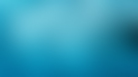 A vibrant cyan and teal gradient background with a soft focus and smooth transition.の写真素材