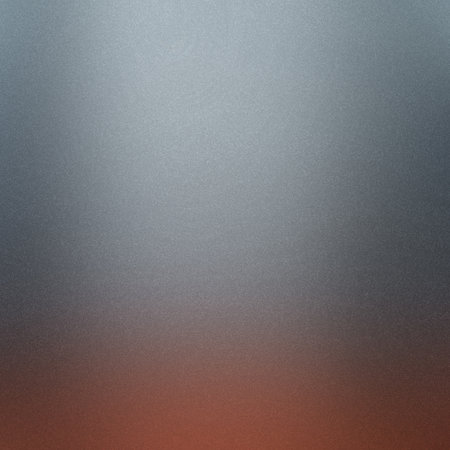 A metallic silver and reddish-brown gradient background with a fine grain texture. Clear details ...の写真素材