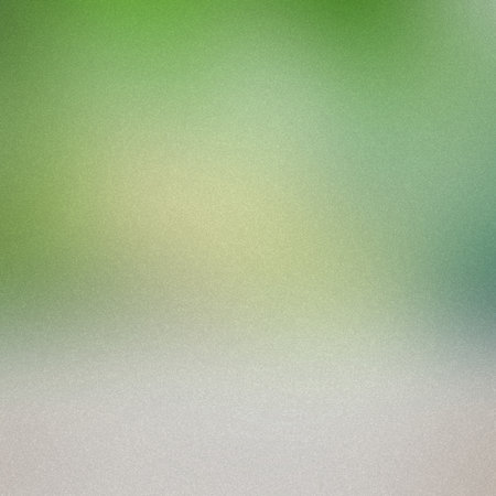 A soft gradient background blending green and yellow hues with a subtle grain texture.の写真素材
