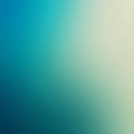 A soft gradient blends blue, teal, and white with a subtle grain texture throughout.の写真素材
