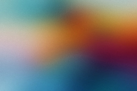 An abstract multi-color textured gradient with soft blending of blue, orange, red, and purple hues.