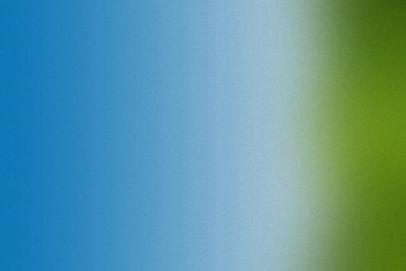 A blurred gradient transitioning from blue to green with a subtle noise texture. Clear details an...の写真素材