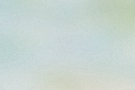 A pale green and blue gradient with a fine grain texture forms a soft abstract background.
