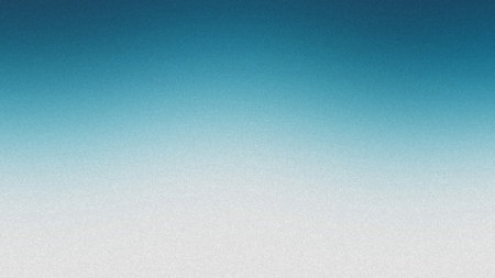 A blue and white gradient background with a fine grain texture and diffused light. Clear details ...の写真素材