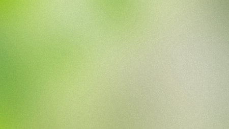 A soft gradient of light green and beige with a fine grain texture. Clear details and vibrant col...の写真素材