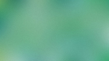 A soft green and teal gradient background with a fine grain texture. Clear details and vibrant co...の写真素材