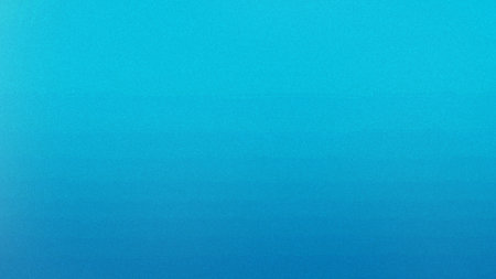A smooth gradient background transitions from light aqua to deep blue with a subtle grain texture.の写真素材