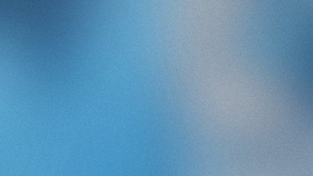 Soft blue and white gradient with a subtle grain texture creates a gentle backdrop.の写真素材