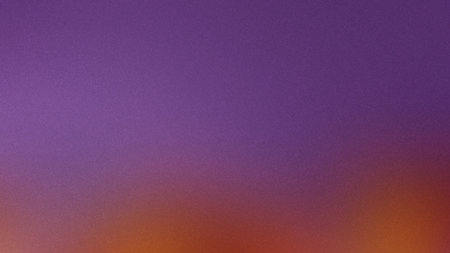 Texture showing purple and orange gradient with grainy texture.の写真素材