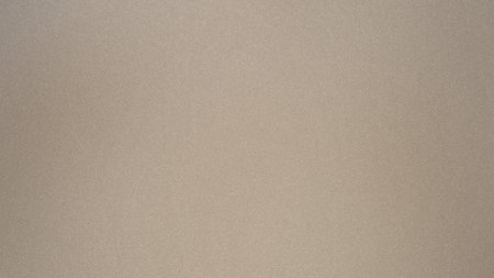 Neutral beige textured background with a subtle grain effect and even lighting. Clear details and...の写真素材