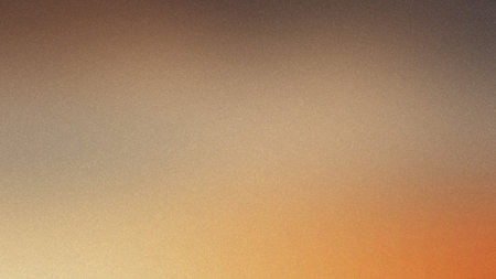A warm gradient background transitioning from brown to orange with a fine grainy texture.の写真素材