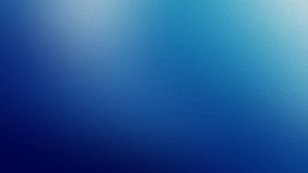 A smooth gradient from light blue to deep blue with a fine grain texture. Clear details and vibra...の写真素材