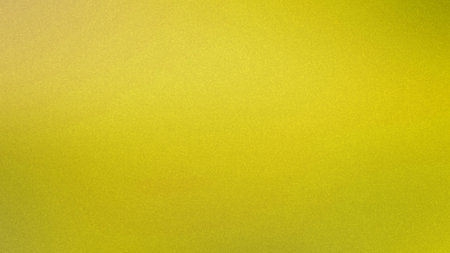 Bright yellow textured gradient background with a subtle grain effect and soft light.の写真素材