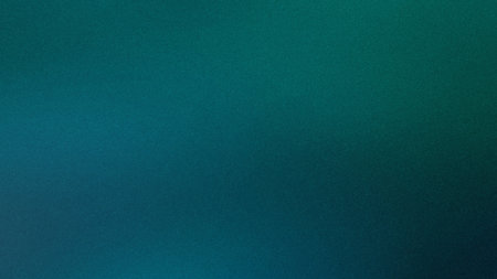 A smooth gradient of deep teal transitioning to dark blue with a subtle grain texture.の写真素材