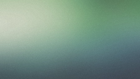 A gradient background transitioning from light green to gray with a speckled texture.の写真素材