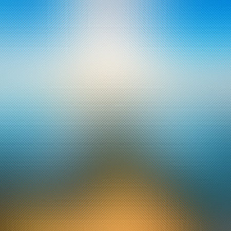 Soft gradient of blue and orange with a subtle textured overlay creating a blurred effect.の写真素材