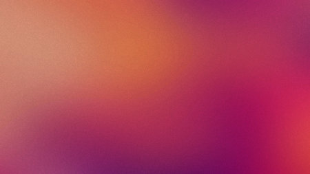 A soft gradient background transitions from warm orange to pink and purple with a subtle grain...の写真素材