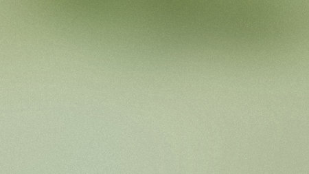 A subtle light green textured gradient background with a fine grain pattern. Clear details and vi...の写真素材