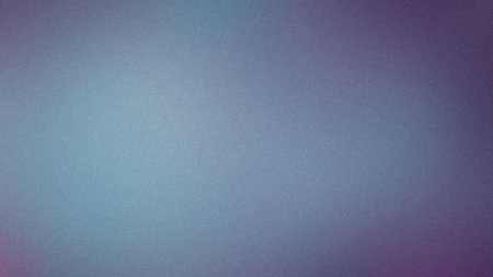 A soft, grainy gradient transitions from light blue to muted purple and violet hues.の写真素材