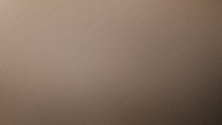 A smooth taupe and brown gradient background with a fine grain texture. Clear details and vibrant...の写真素材