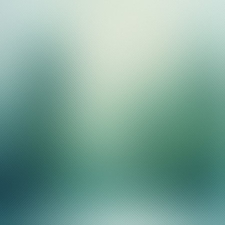 A soft, blurred gradient background with a frosted glass texture in pale green and white tones.の写真素材
