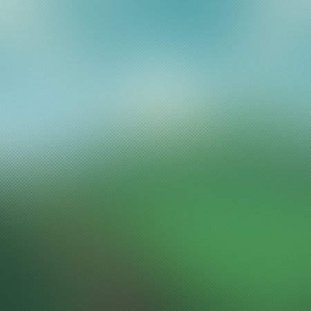 Soft blue sky blends into a green field with a subtle textured pattern. Clear details and vibrant...の写真素材