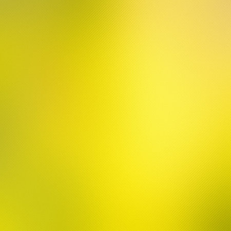 A vibrant yellow gradient with a subtle textured pattern and a bright central glow.の写真素材