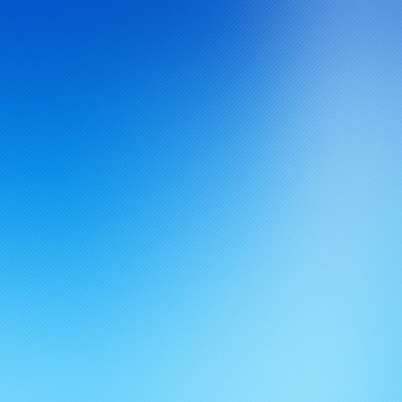 A vibrant blue gradient background with a subtle textured pattern throughout. Clear details and v...の写真素材