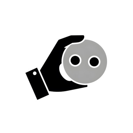 A black hand holds a grey circle with two black eyes on a white background Clear details and vibr...の写真素材