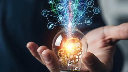 Hand holds a glowing light bulb with internal gears and a network of digital icons radiating energy.