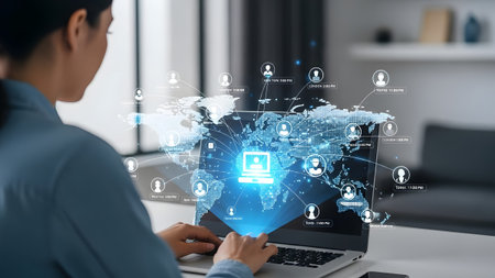 Woman uses a laptop displaying a holographic global network with people icons. Clear details and ...