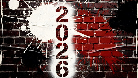 Year 2026 spray painted vertically on a brick wall with white and black paint splatters.