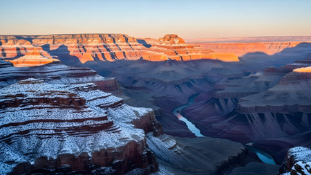 Winter wonderland at grand canyon: majestic sunrise painting snow-dusted cliffs with golden lightの写真素材