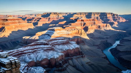 Winter wonderland at grand canyon: a stunning view of snow-dusted cliffs and the colorado riverの写真素材
