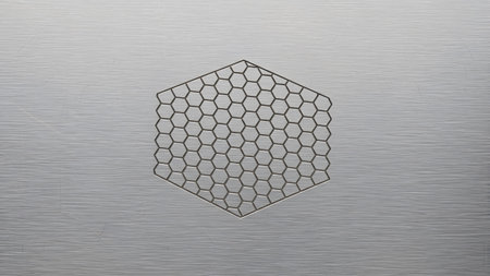 Brushed showing hexagonal honeycomb pattern etched onto a brushed metallic silver background...