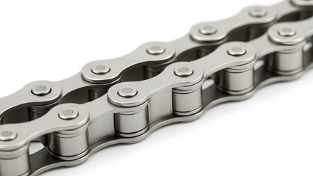 A detailed close-up of a silver metal bicycle chain reveals interconnected links and cylindrical...