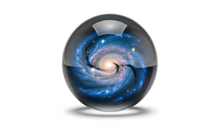 Stock showing glass ball reflecting a detailed blue and yellow spiral galaxy with stars on...