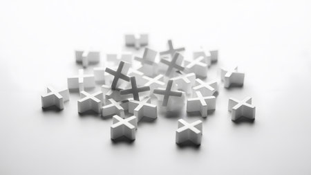 Small showing numerous small white plus-shaped game pieces clustered together on a bright white...