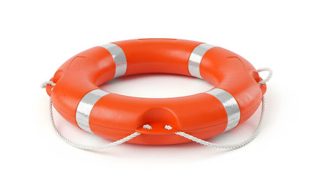 A vibrant orange life preserver ring with silver stripes and white rope casts a subtle shadow on...
